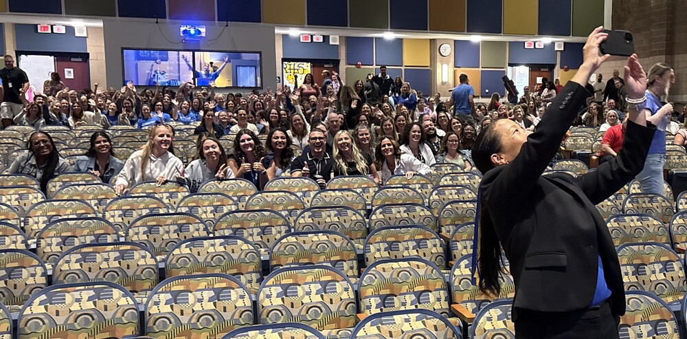 The superintendent of schools takes a selfie with teachers