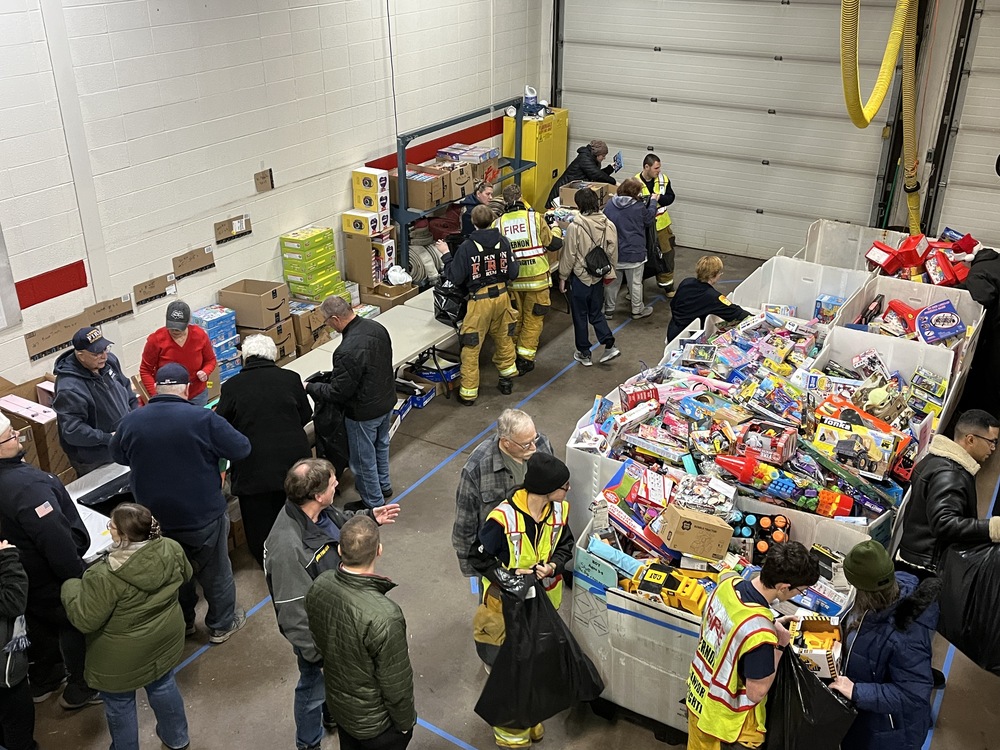 firefighters sort toys for Toys for Tikes