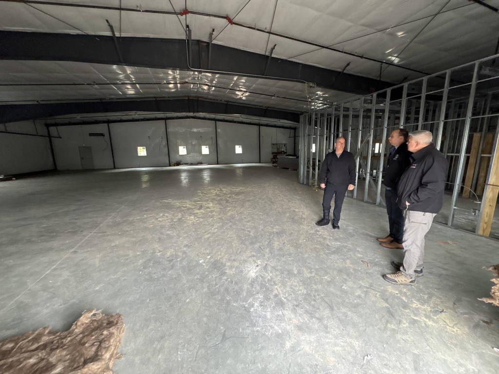 Mayor Champagne and staff inside the building