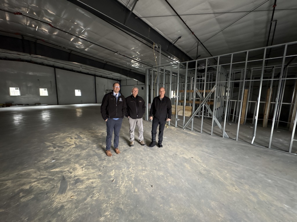 Mayor Champagne and staff inside the building