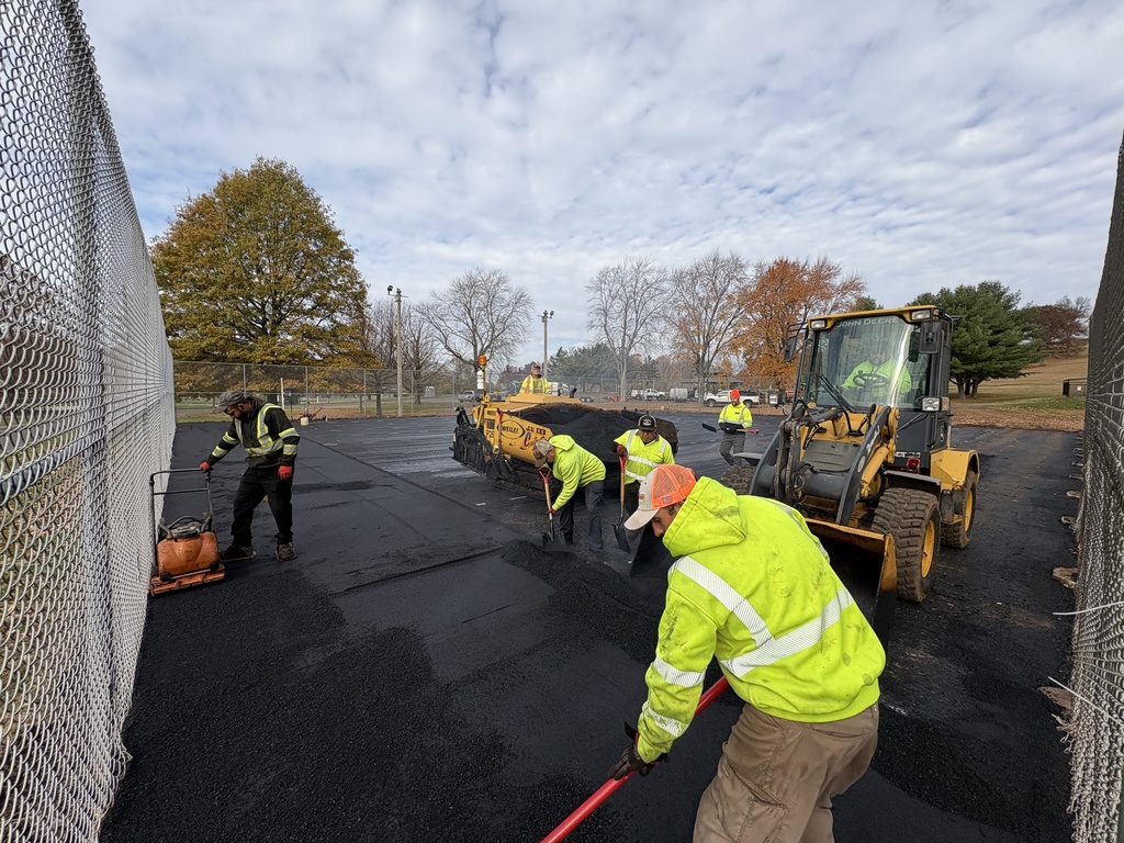 Paving of tennis court at Henry Park