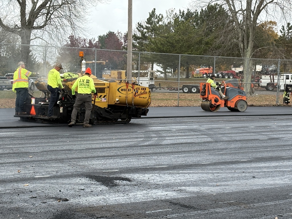 Paving of tennis court at Henry Park