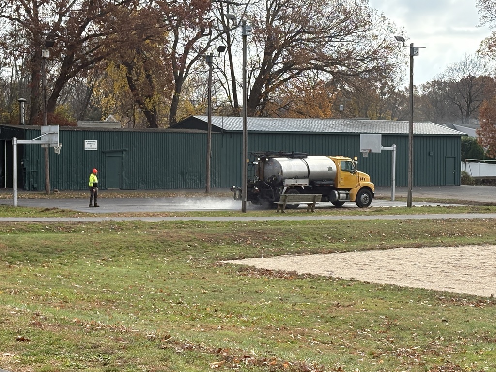 Paving of tennis court at Henry Park