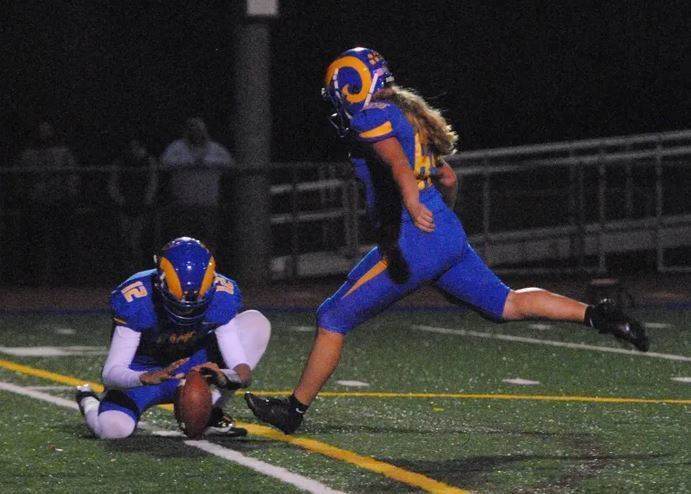 Molly Wilson kicking a point after touchdown