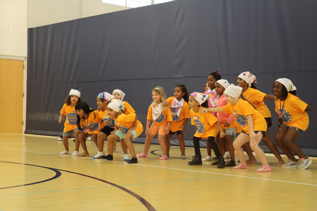 Children dancing at hip hop dance camp.
