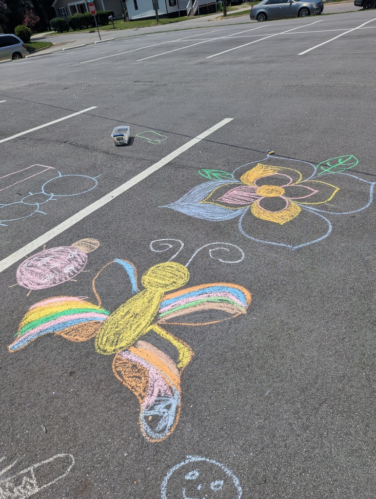 Sidewalk chalk drawings of a colorful butterfly and flower.