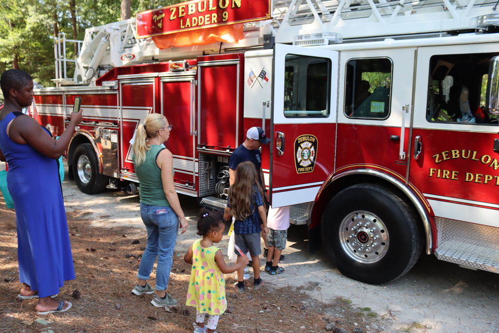 Line of people waiting to go inside fire truck