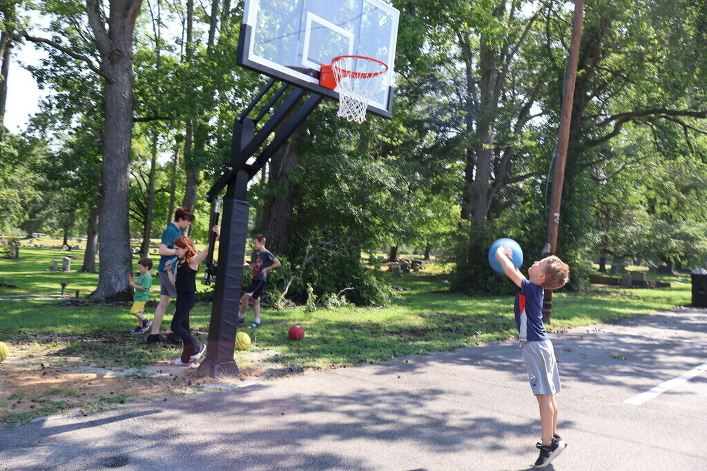Little boy shooting a basketball