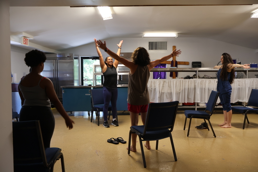 Women participating in chair yoga
