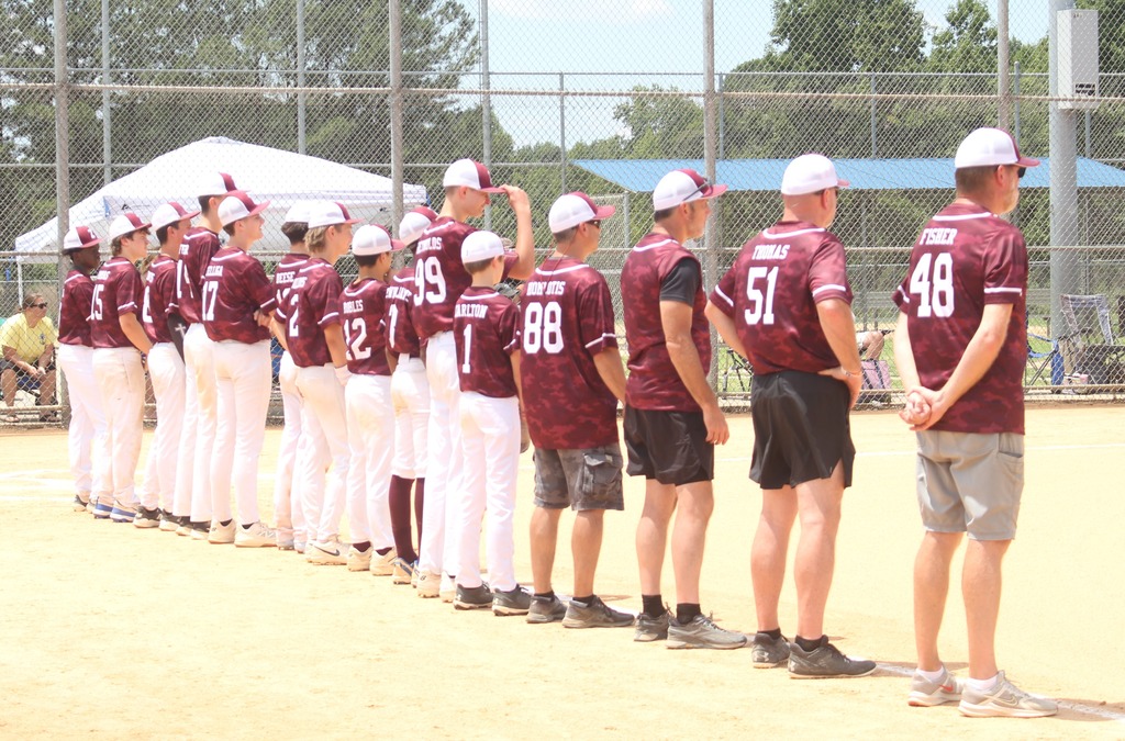 team lined up on baseball field