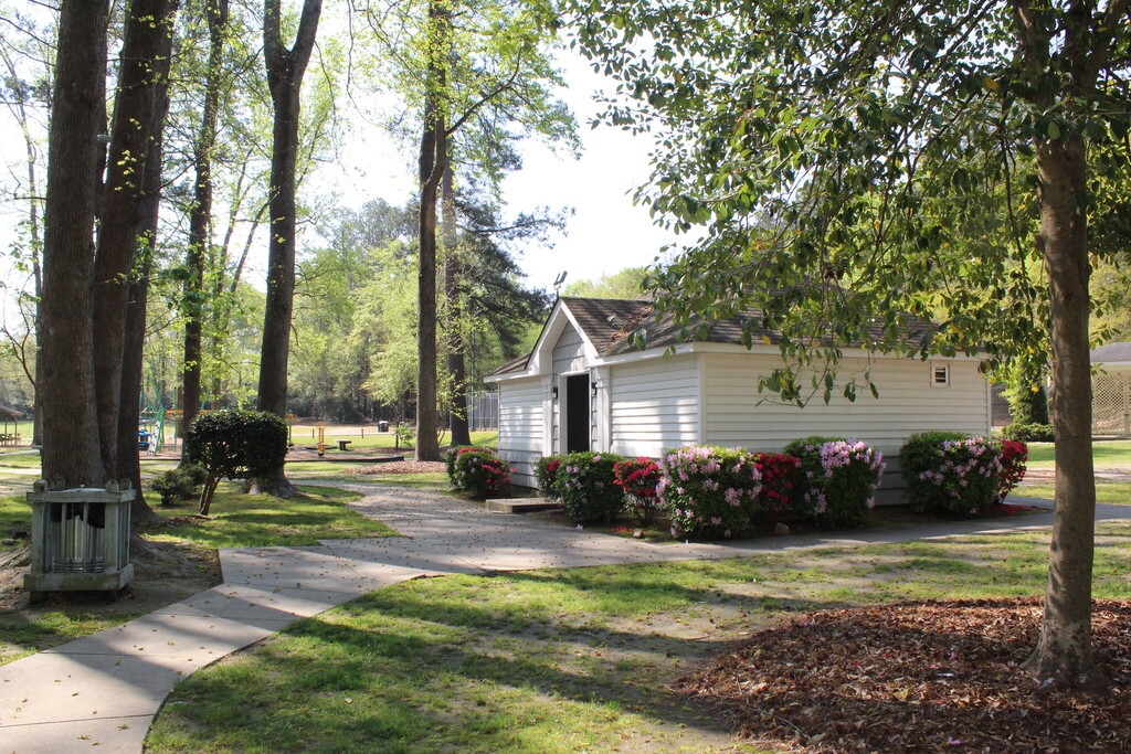 Building surrounded by flowers in the park