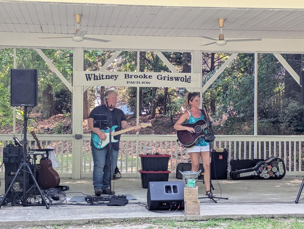 Band playing music underneath the amphitheatre in the park