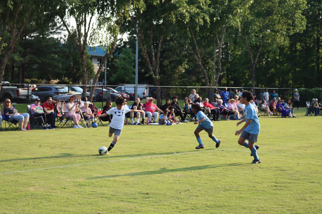 Children playing soccer