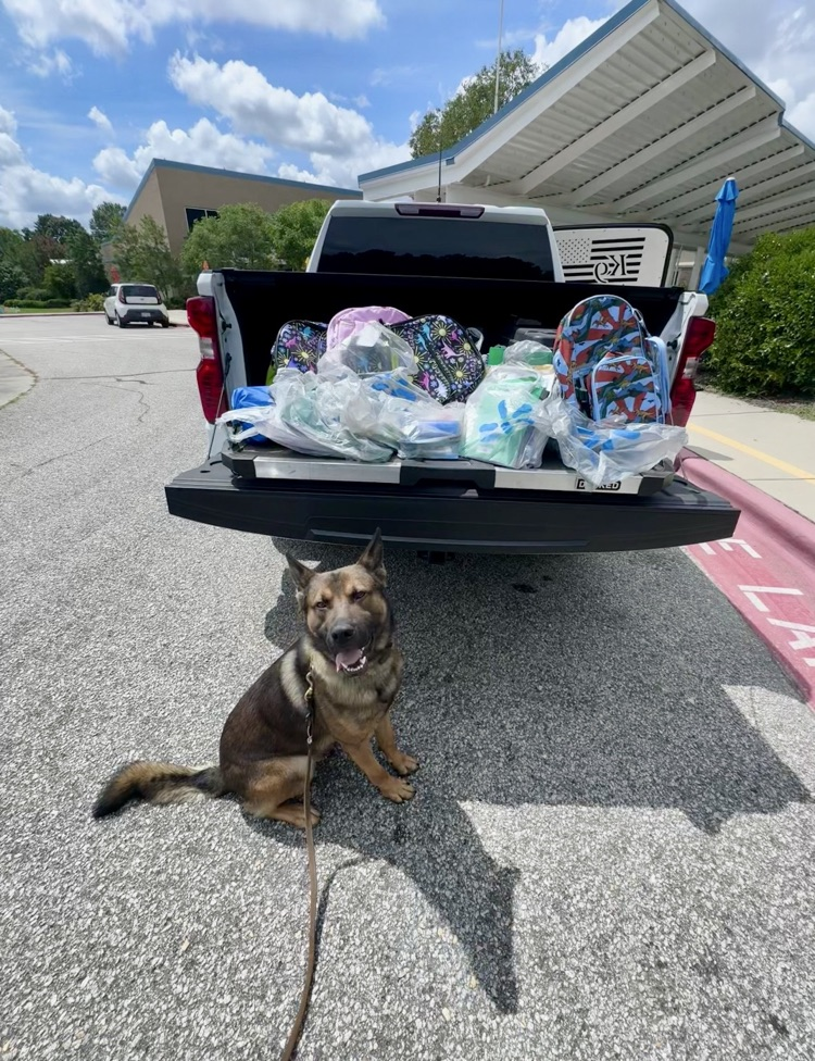 dog and a truck with school supplies