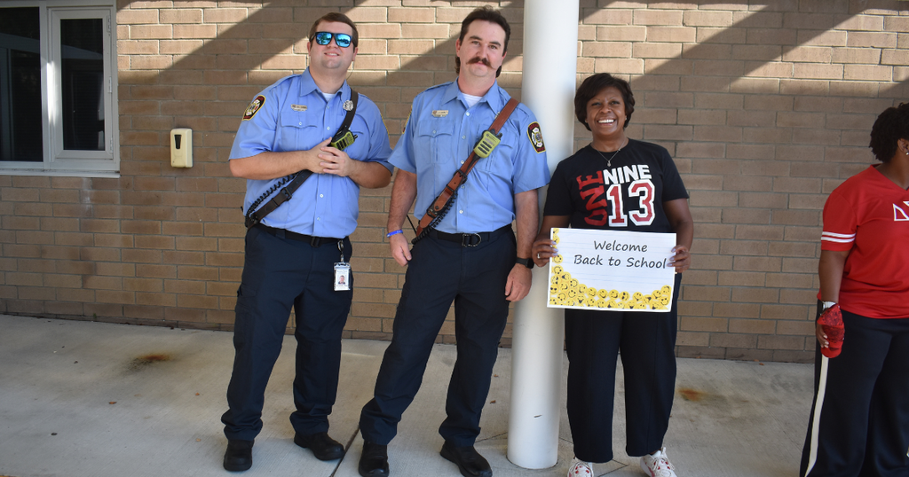 two fire fighters and a person