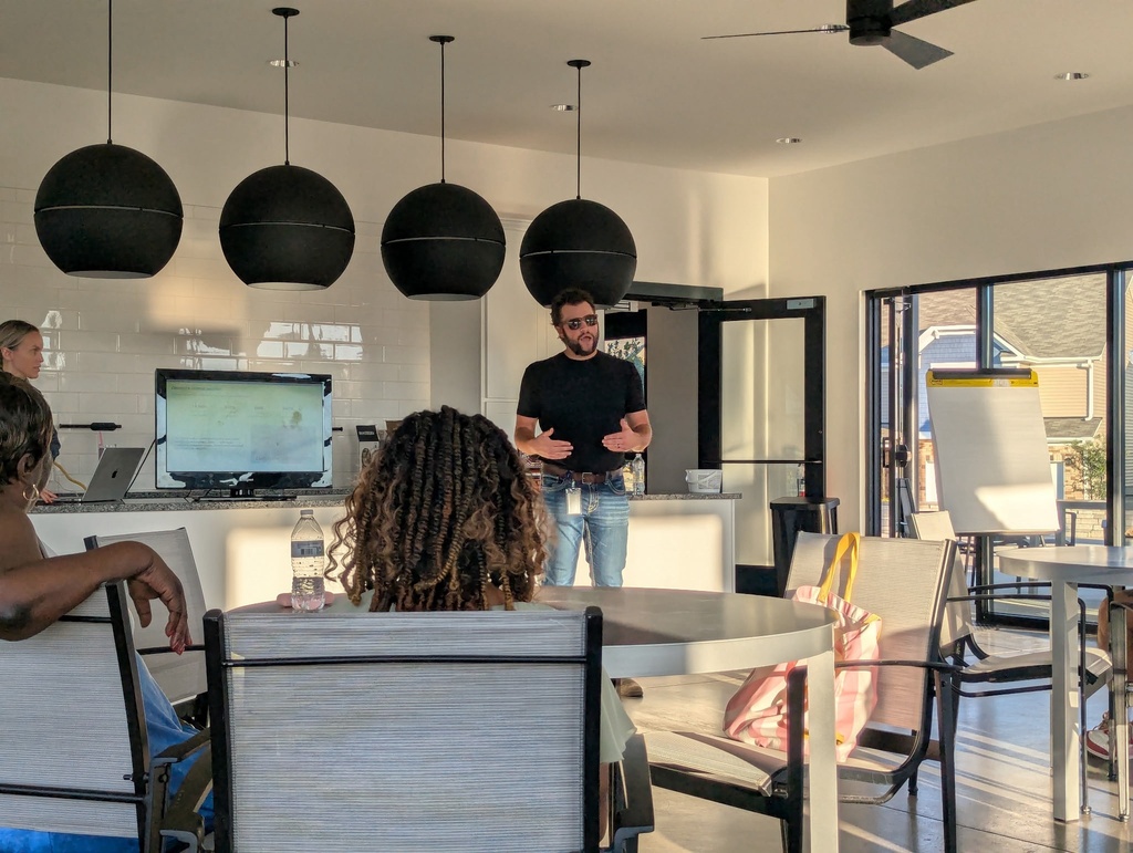 one guy standing and talking in a room