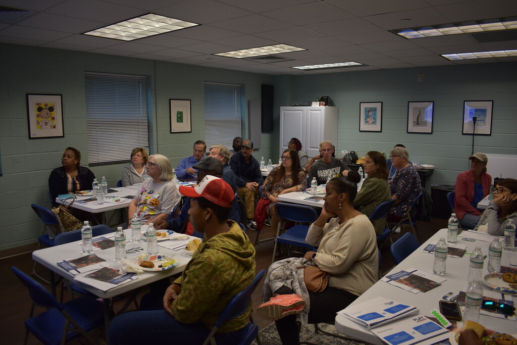 Citizens listening to a presentation.