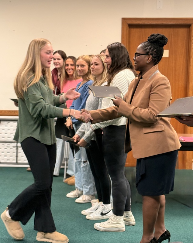 Mayor Aneka Miller presents certificate of awards to the Bordentown Regional High School Girls' Basketball team