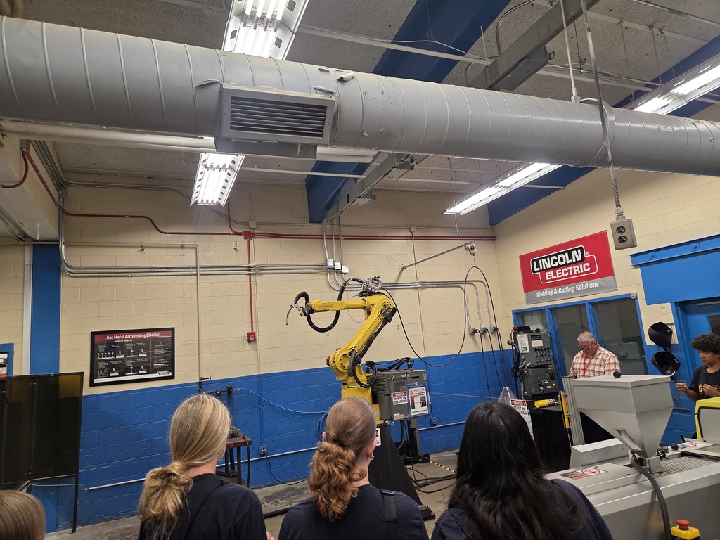 tcs students watching robotic arm at ab-tech