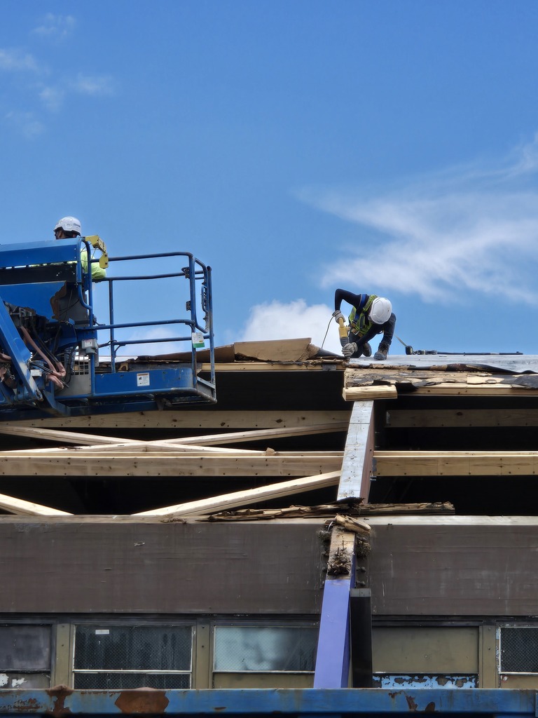 workers working on old gym roof at bhs