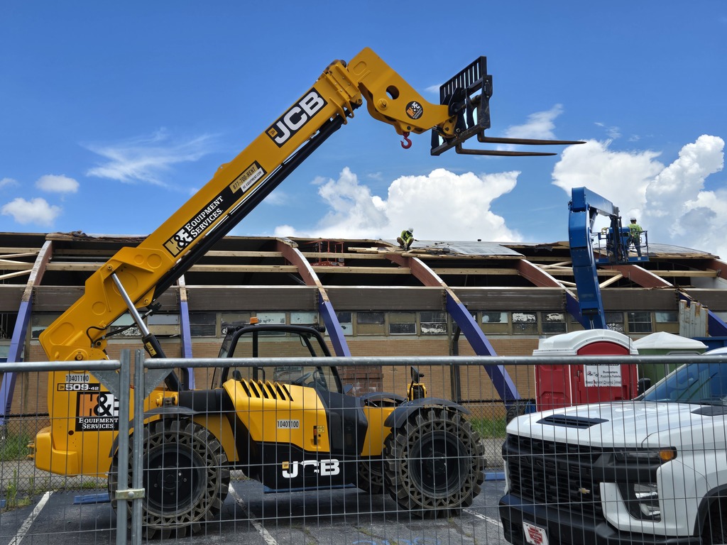 workers working on old gym roof at bhs