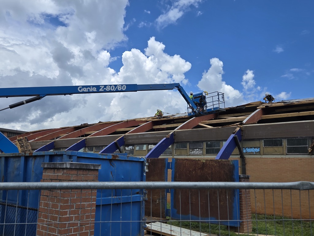workers working on old gym roof at bhs