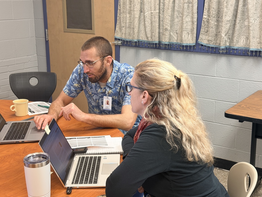 Mr. Colegrove working with teacher