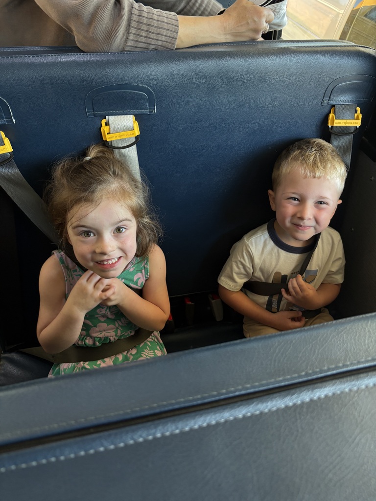 Kids smiling in the seats