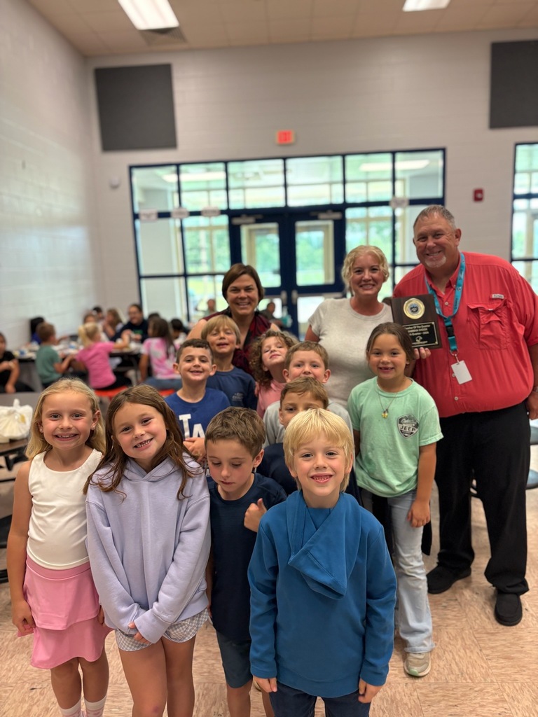 Mrs. Shook's class celebrates her being our Teacher of the Quarter. 