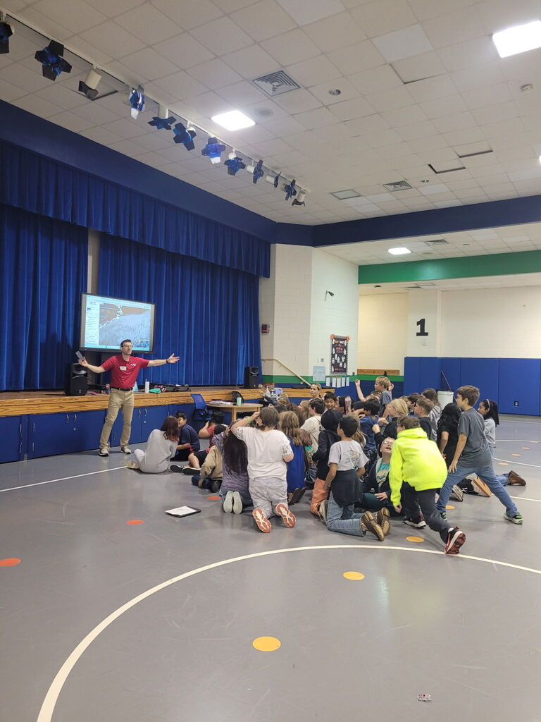 Jason Boyer presents on weather to the 5th grade students at PFE!