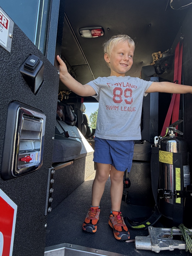 Student coming out of the firetruck.