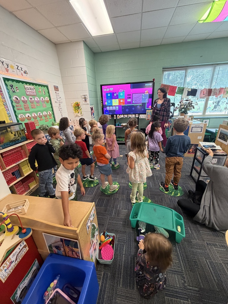 Pre-K students have a visit from a librarian.