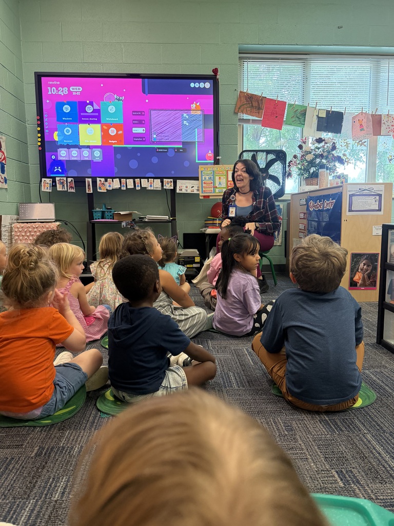 Pre-K students have a visit from a librarian.