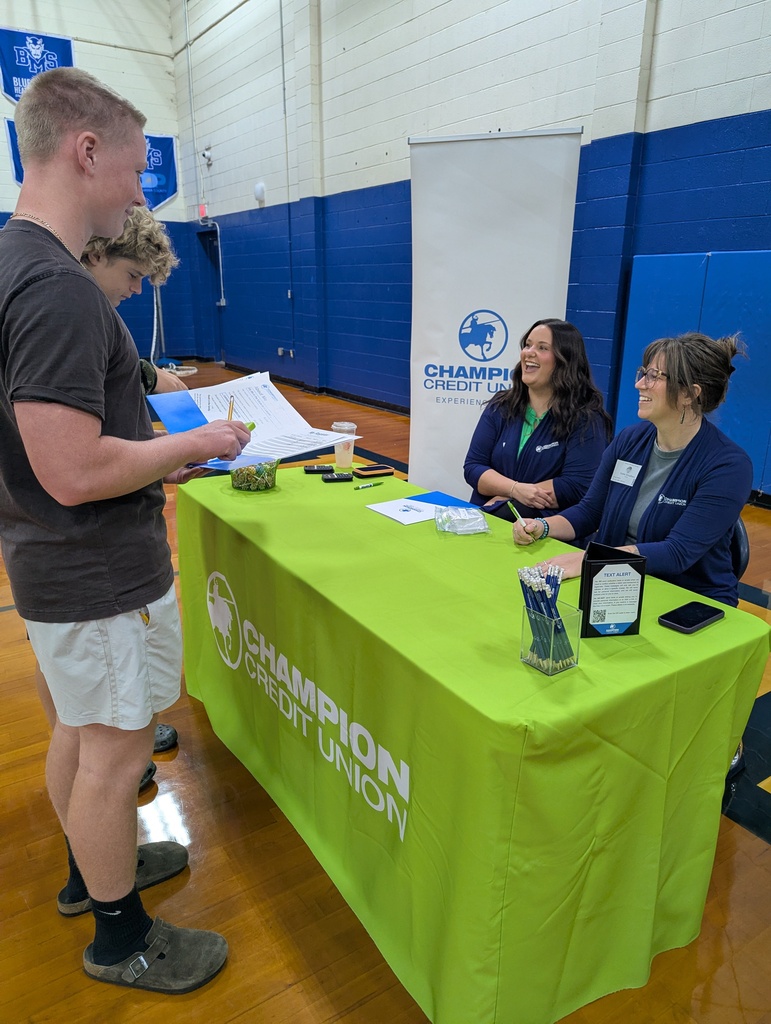Students speak with champion representatives in BMS gym