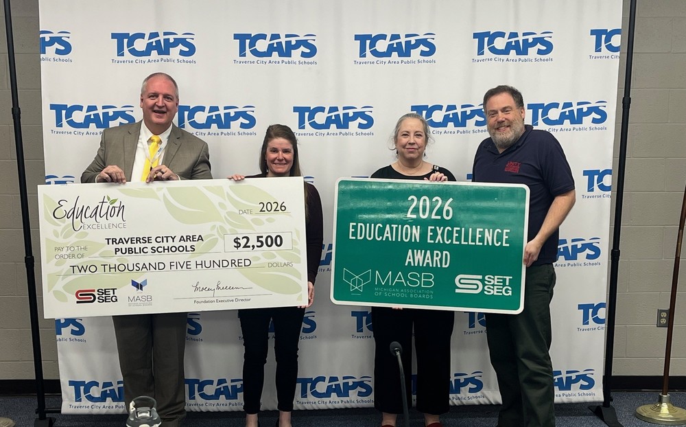 (Pictured from left to right): Dr. John VanWagoner, Superintendent; Casey Kilcherman, SET SEG; Katie Kubesh, Student Support Network (SSN) Coordinator; and Scott Newman-Bale, TCAPS Board of Education President.
