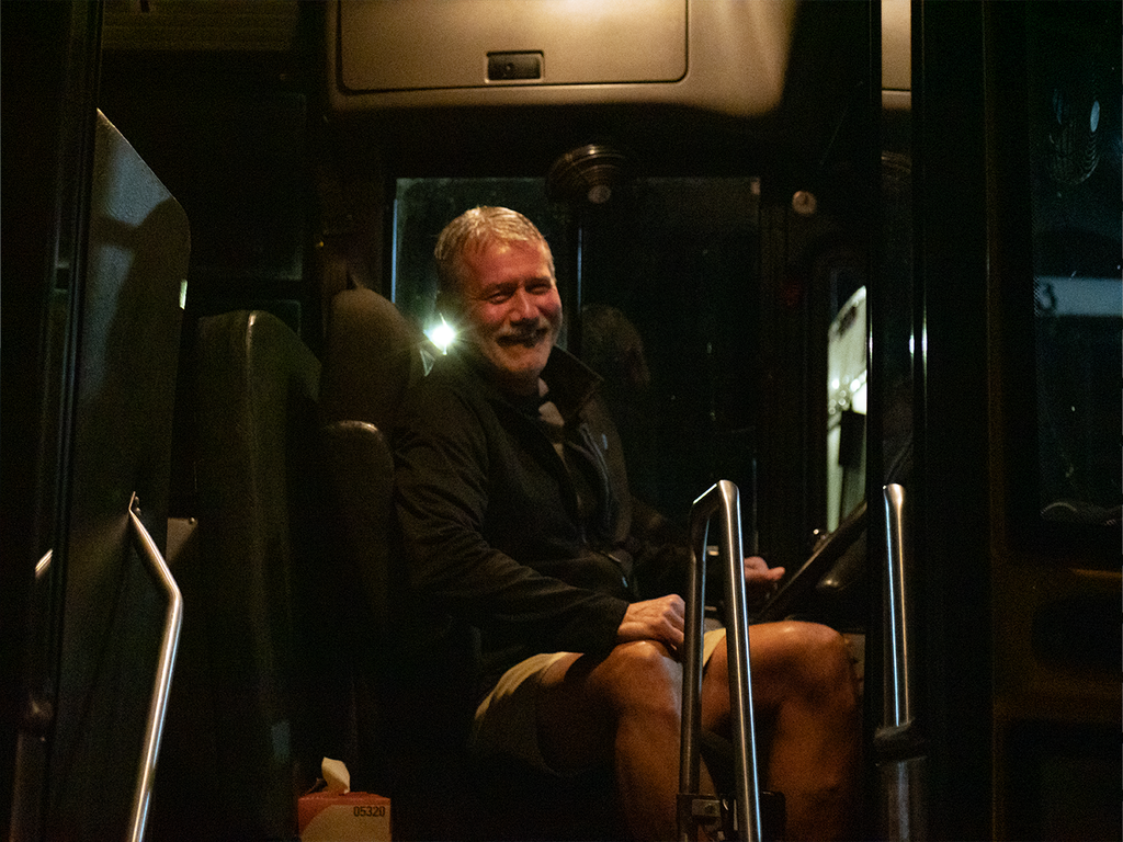 Bus driver smiling on first day of school