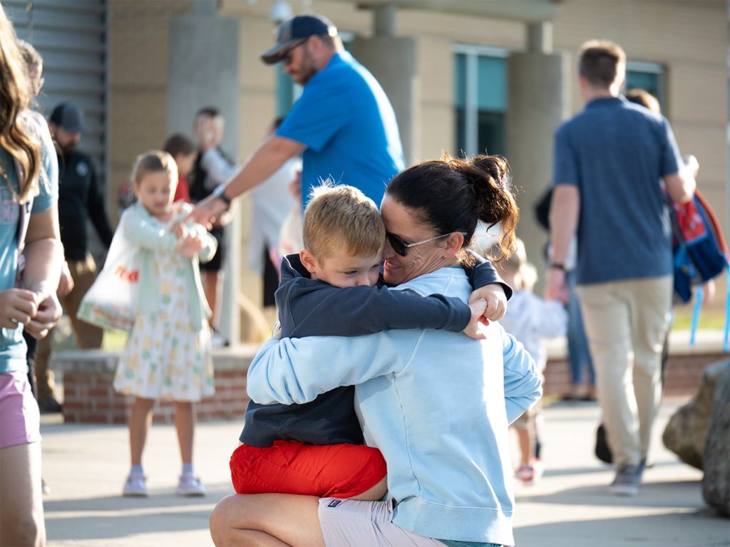 Student with parent on first day of school