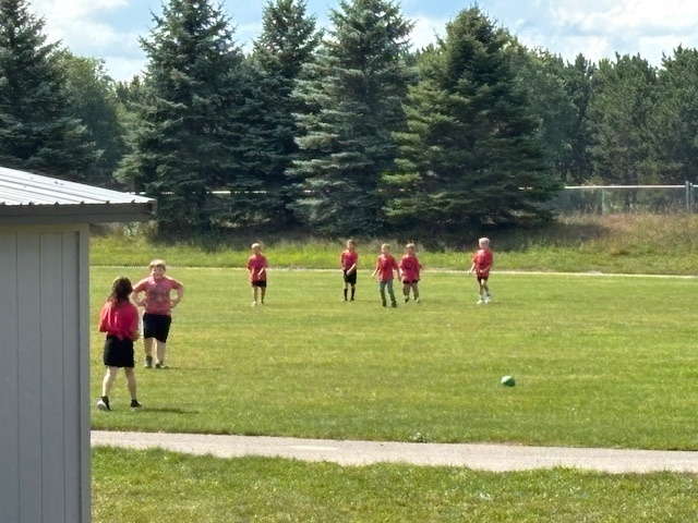 Look at all the red shirts on the playground!