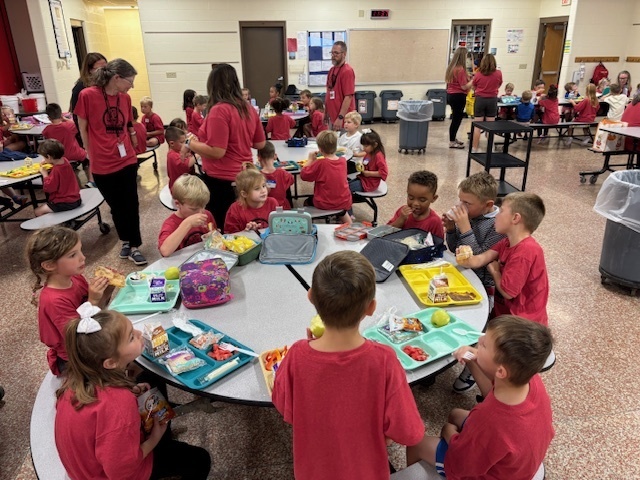 Lots of help for our littlest Cougars as they learn to open lunches!