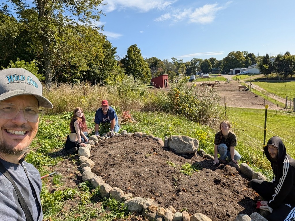 TCHS students and staff planting a garden Reigning Liberty