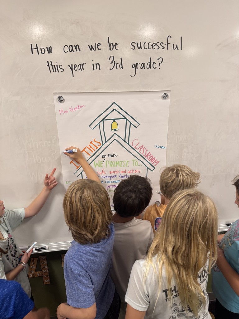 students writing on paper