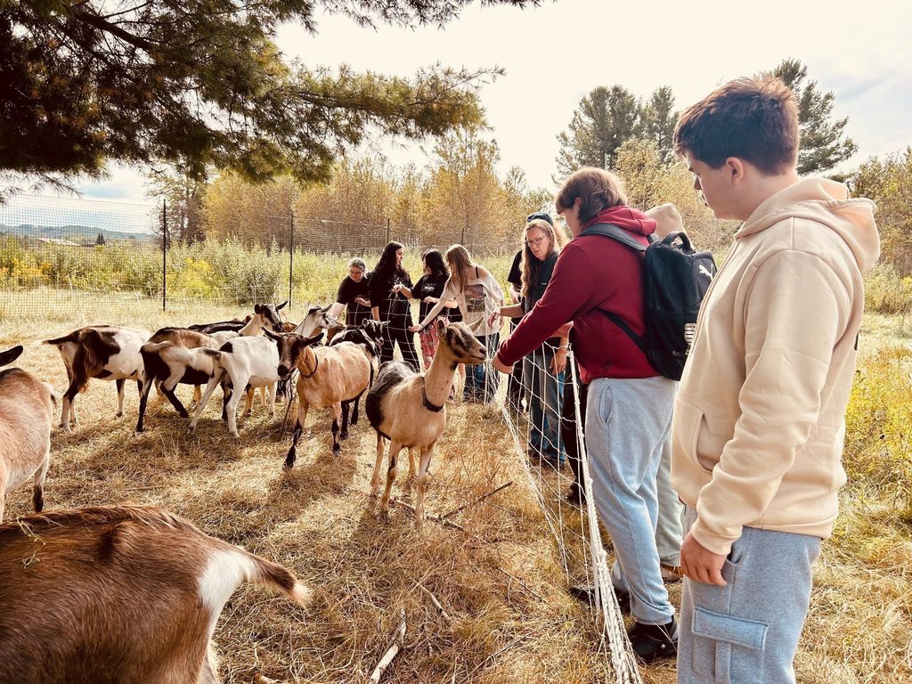 TCHS students and staff learn about the goats at GTRLC