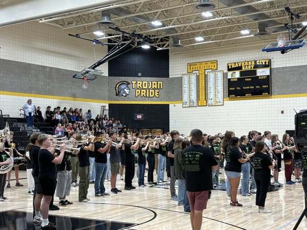 Students playing instruments in the school gym