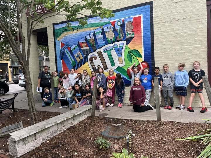 students standing in front of a wall