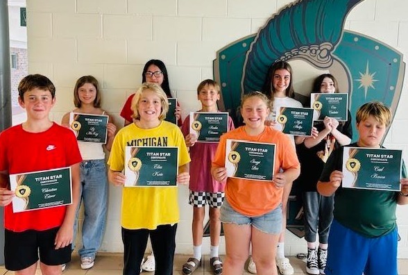 Students holding certificates