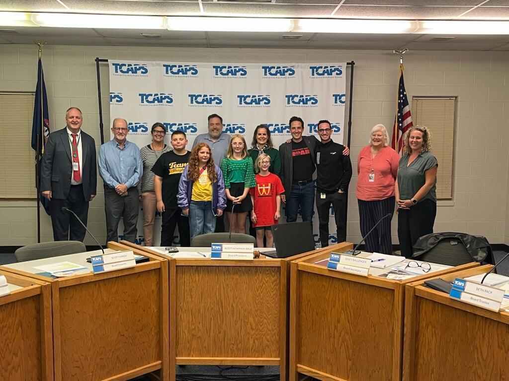 The TCAPS Board of Education pictured with Traverse Heights staff and students for recognition.