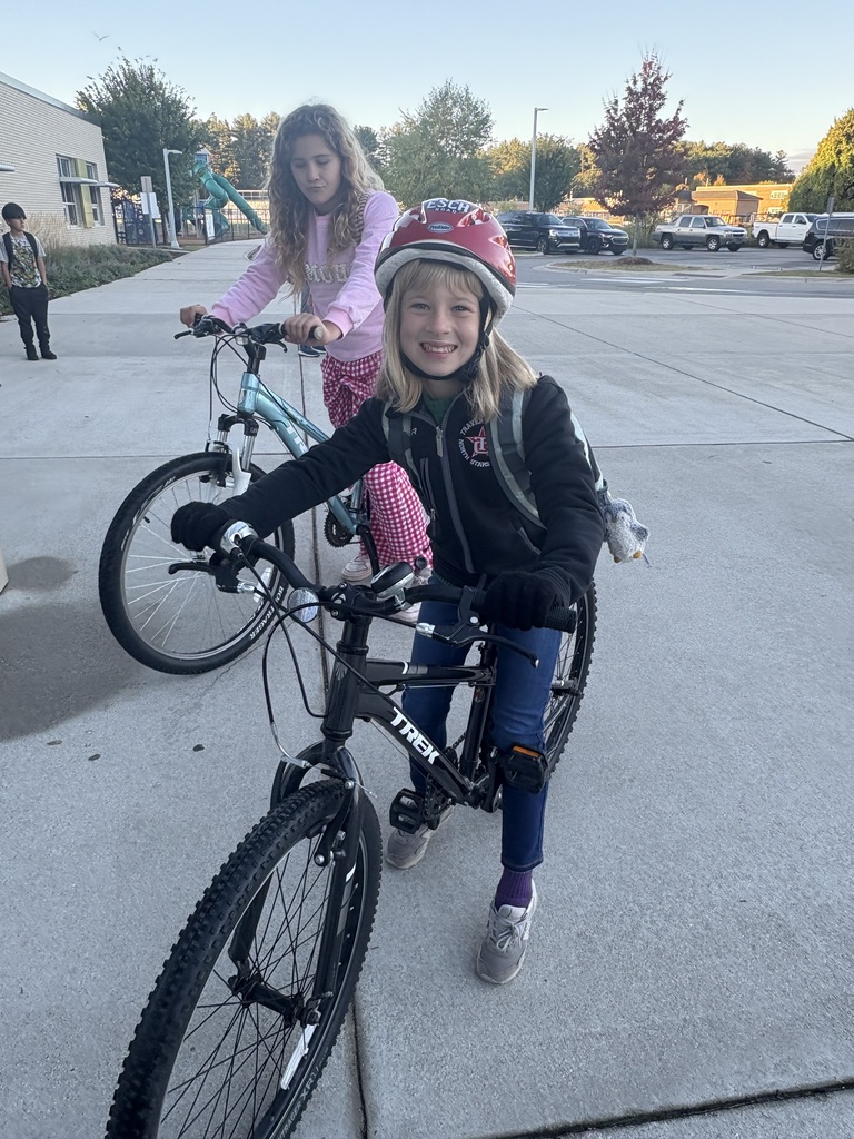 Two girls on bikes
