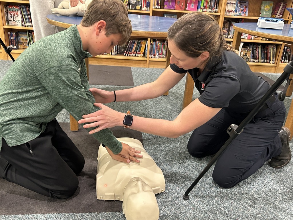 Students practicing CPR on a mannequin
