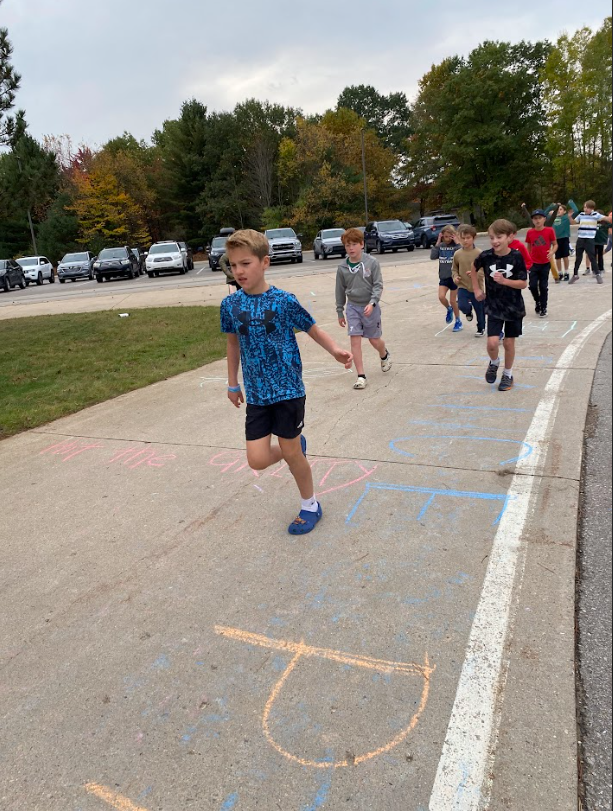 Move- A -Thon. Children running in line.
