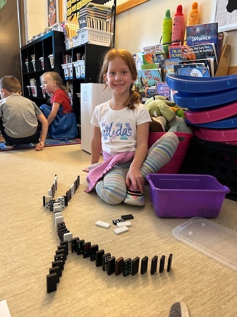 Student playing dominos